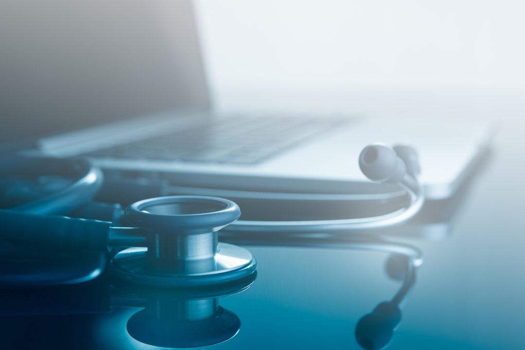 Know the Clinical Team: A closeup of a stethoscope and a laptop computer.