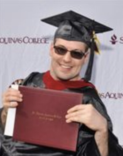 LIFEPlan Member John Thompson at Graduation proudly showing his diploma.
