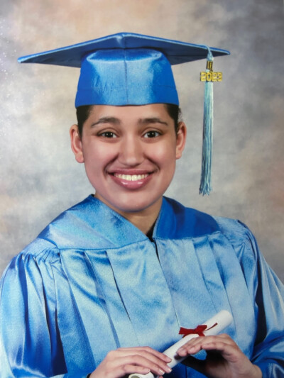 LIFEPlan Member Alexis Elsa Melendez posing for graduation photo.
